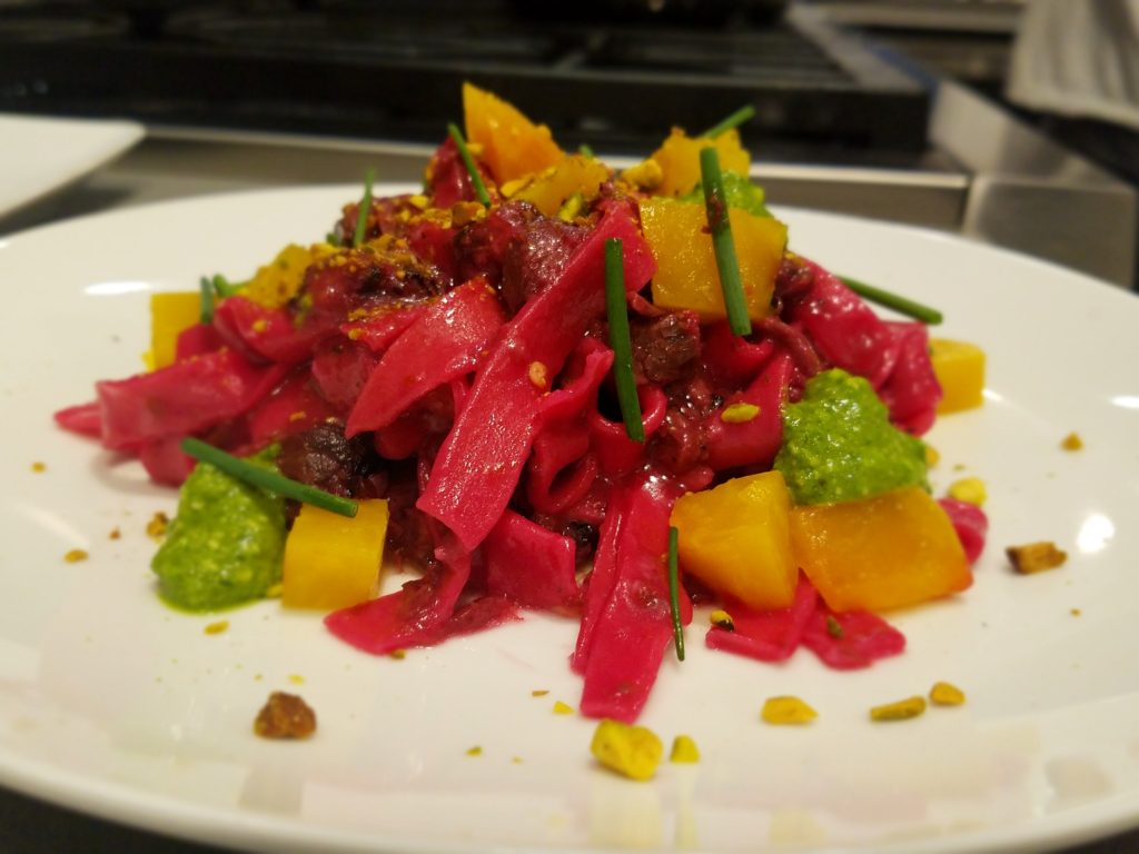 Beet pasta with golden beets and beettop pesto